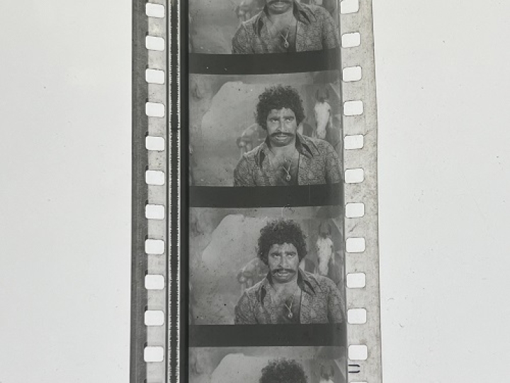 35mm film frames depicting man in paisley shirt.