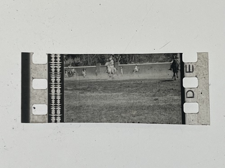 35mm film fragment depicting a man on a horse.