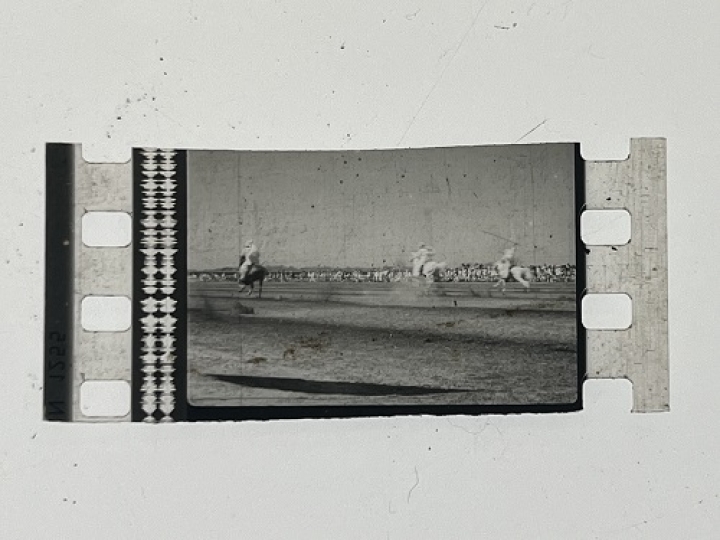 35mm film fragment depicting a man on a horse.