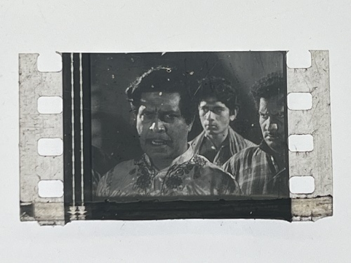 35mm film frames depicting man with friends.