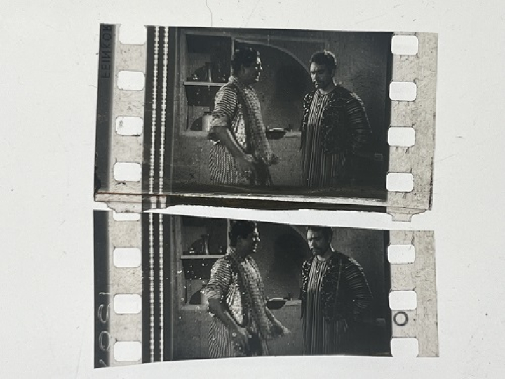 35mm film fragment depicting Sultan Rahi with a man.