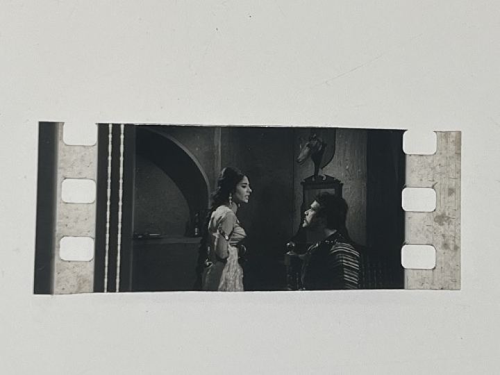 35mm film fragment depicting Sultan Rahi with a woman.