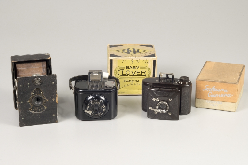 Three cameras and boxes