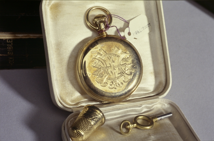 Gold watch with GE initials