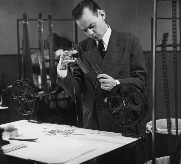 Unidentified photographer. Lothar Wolff at work editing The March of Time, ca. 1938. Gelatin silver print. George Eastman Museum, gift of Violet Wolff.