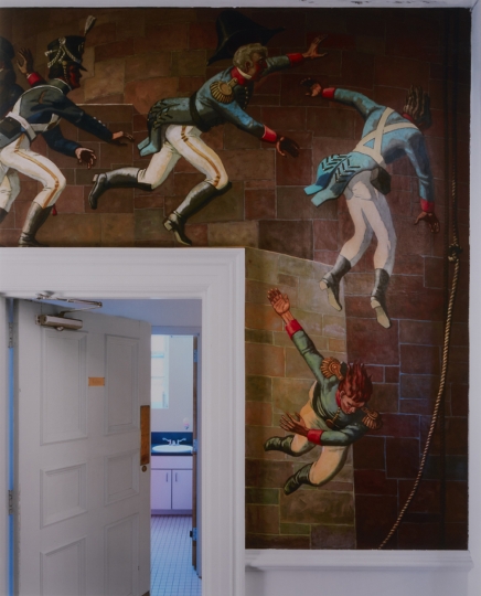 Photograph by Andrew Moore depicting a doorway surrounded by a painted mural of soldiers