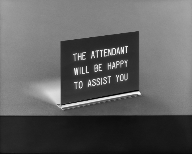 sign that reads "The attendant will be happy to assist you" 