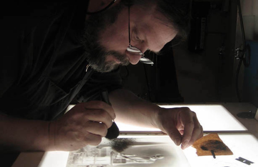 Mark retouching a glass plate photograph