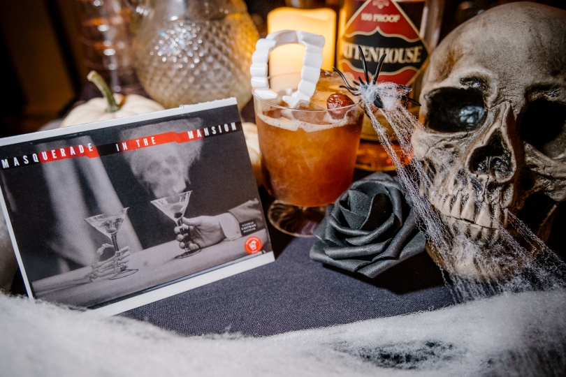 A haunted cocktail, skull and spiderwebs
