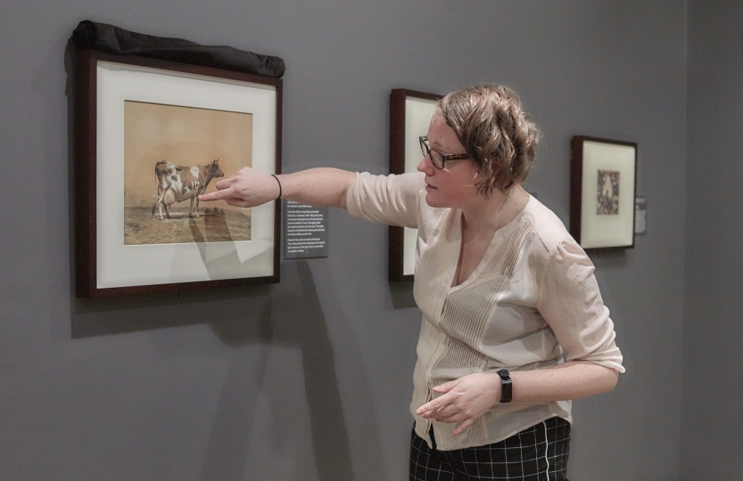 Meghan Jordan giving a tour of an exhibition