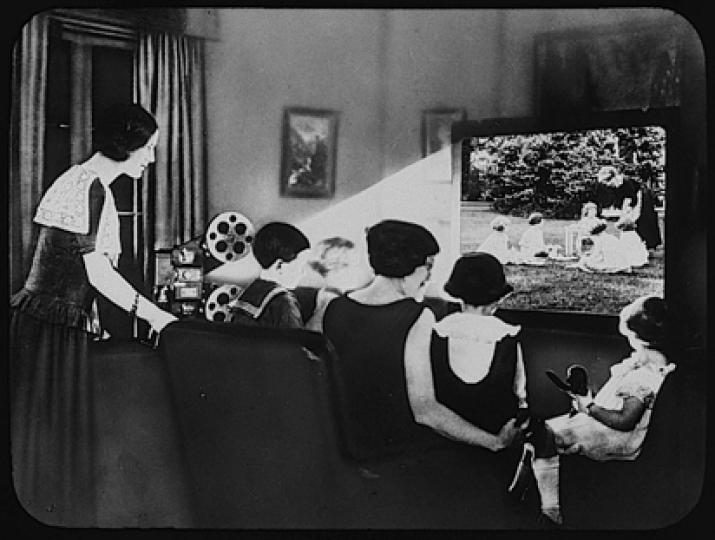 Eastman Kodak Company (Rochester, New York, estab. 1892), The Kodascope giving an indoor movie entertainment. Transparency, gelatin on glass. George Eastman Museum, gift of Eastman Kodak Company.