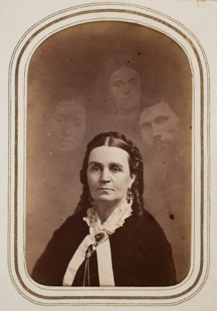 Woman with three ghostly heads surrounding her