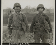 Two Students Demonstrate the Importance of Eye Shields and Gas Masks at a Gas School in Northern Ireland, January 14, 1944.