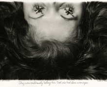 Shot of half a woman's face seemingly laying down with jacks (the kids toy) over her eyes