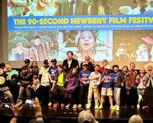 Filmmakers standing on stage at the Dryden Theatre during the 90-Second Newbery Film Festival