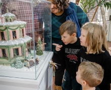 Family looking at gingerbread