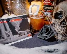 A haunted cocktail, skull and spiderwebs