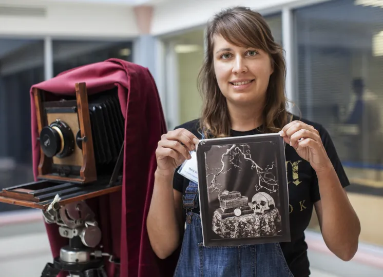 Woman holding a salted paper print