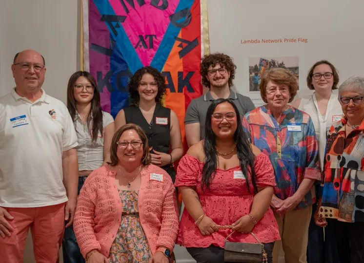 "Lambda leaders Dan Sapper, Kathryn Rivers, and Emily Jones with RIT student researchers and project lead Dr. Tamar Carroll at the Picturing Equality opening reception.  Left to right, standing in back: Dan Sapper, Melissa Xie, Cassidy Wall, Kyle Messerle, Kathryn Rivers, Noelle Marino, Emily Jones. Seated in front: Tamar Carroll and Emmarose Tabin."