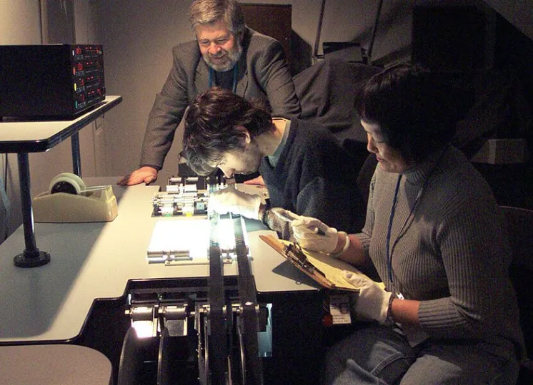 Students inspecting a print