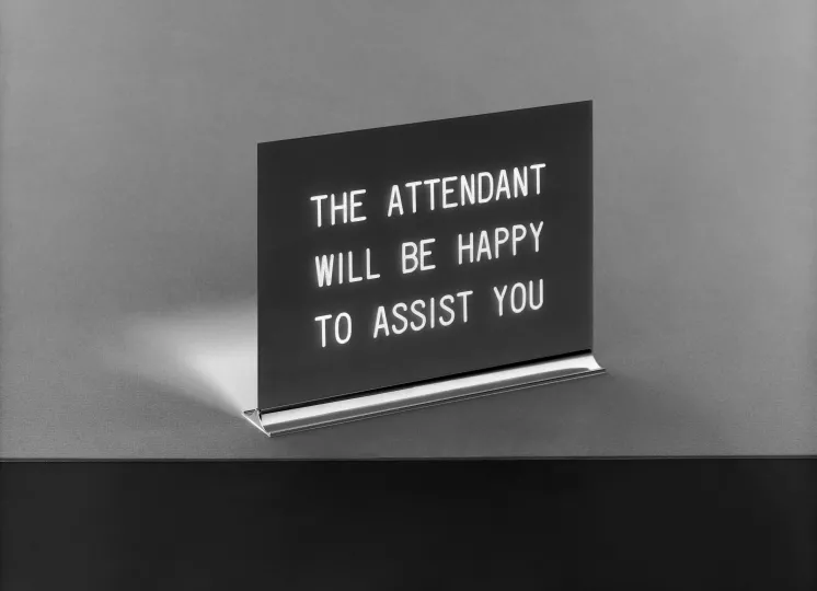 sign that reads "The attendant will be happy to assist you" 