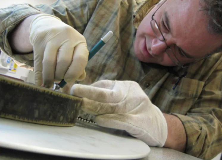 Students inspecting a print