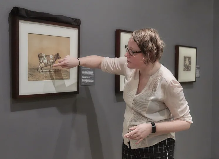 Meghan Jordan giving a tour of an exhibition