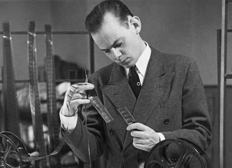 Image from the collection of man looking at object