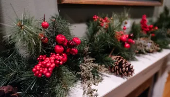 Holiday mantle with pine and berries 