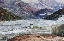 Photograph by Tamas Dezso depicting a church steeple emerging from ice in a valley