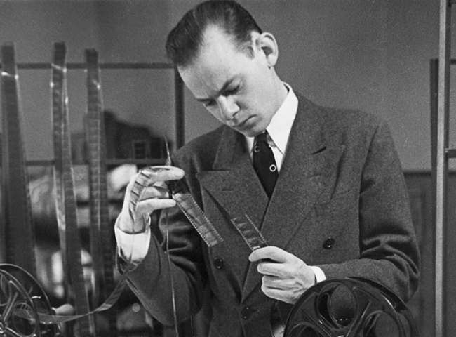Image from the collection of man looking at object
