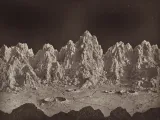 Plate 23, Group of Lunar Mountains, Ideal Lunar Landscape, from The Moon: Considered as a Planet, a World, and a Satellite, 1874 by James Hall Nasmyth and James Carpenter. The woodburytype image depicts the artists' vision of what mountains on the moon would look like. 