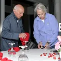 Council members setting tables for the 2025 Valentine's Day Brunch & Film