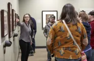Jamie Allen gives a tour in a gallery