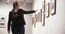 Curator discussing a photograph on view
