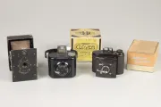 Three cameras and boxes