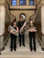 Their group is known as Minus 2 and consists of a French horn player, a euphonium and a tuba.