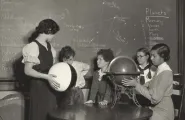 Photograph of four students and a teacher