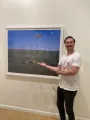 Game night host presenting one of the artists works