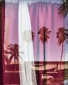 Reflection of palm trees in glass with curtains on other side of glass