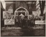 Group of people standing in front of Temple Theatre with signs advertising "The Girl of the Sunny South" 