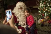 Photograph of Santa and child
