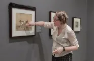 Meghan Jordan giving a tour of an exhibition