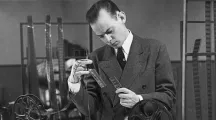 Image from the collection of man looking at object